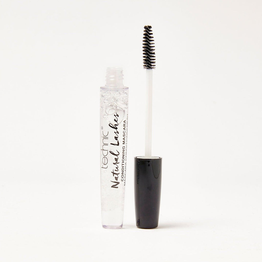 An opened natural lashes clear mascara in front of a white background.