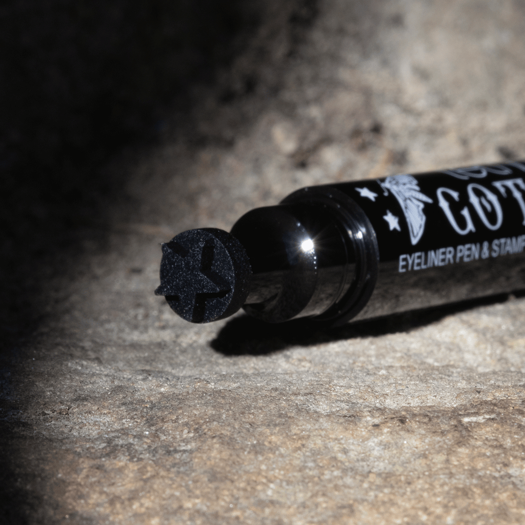 A close up of the eyeliner stamp which is the shape of a star. Its photographed in a shadow effect.