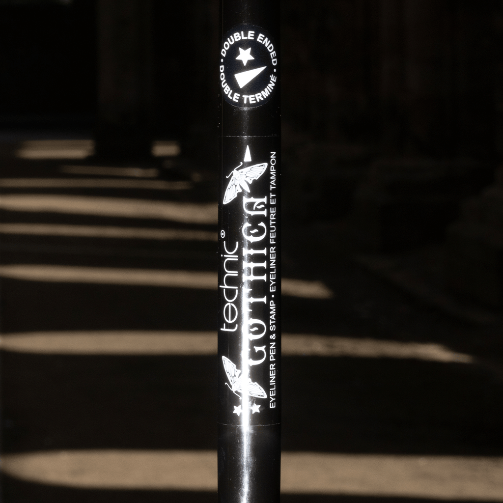 Close up of gothica eyeliner in a dark background setting.