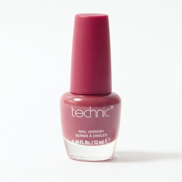 A bottle of nail varnish in the shade Sangria on a white background