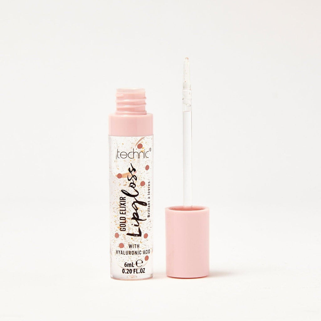 An opened gold elixir lip gloss in front of a white background.