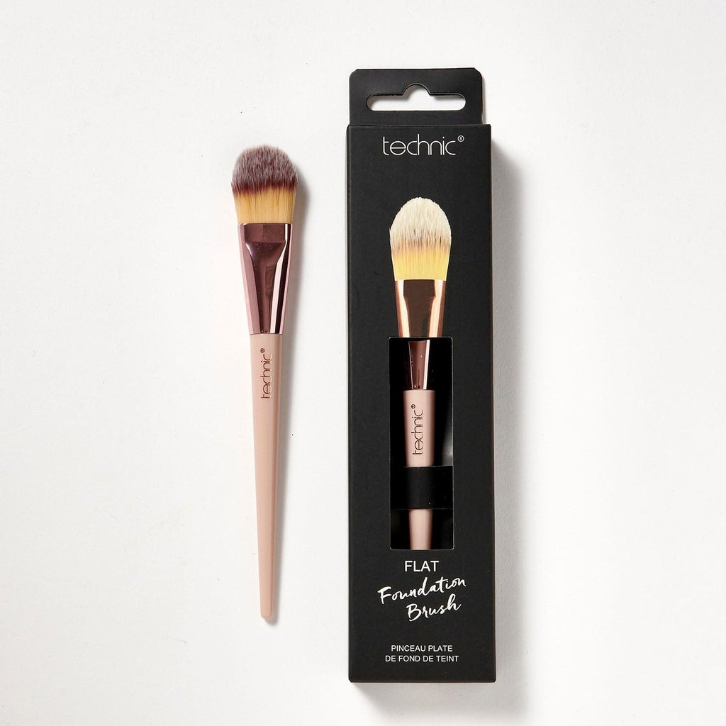 2 flat foundation brushes on a white background. 1 is in its original packaging which is black and has an image of he brush on the front, and the other is out of the packaging.