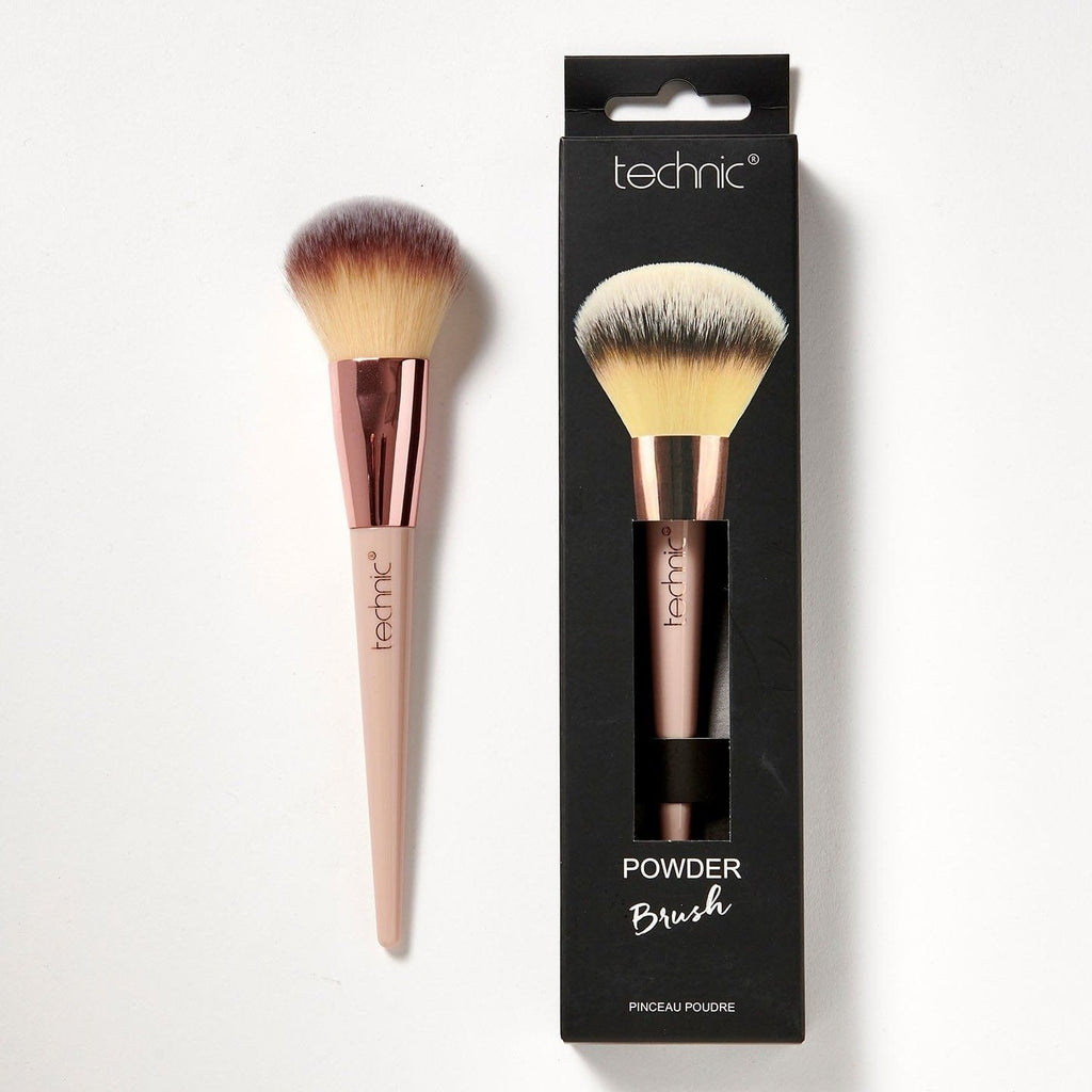 2 powder brushes on a white background. 1 is in its original packaging which is black and has an image of he brush on the front, and the other is out of the packaging.