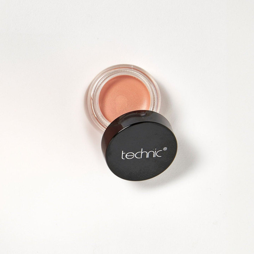 An opened cream blush in the shade First Love on a white background.