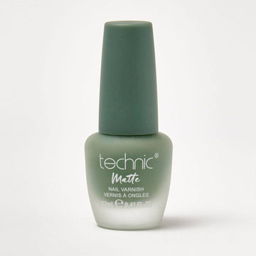 A bottle of matte nail varnish in the shade Green With Envy on a white background