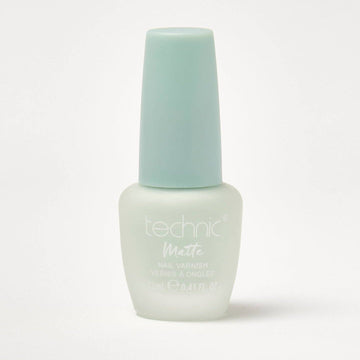 A bottle of pastel matte nail varnish in the shade Minty on a white background