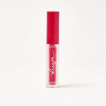 A dream lip tint in the shade Berry Haze on a white background.
