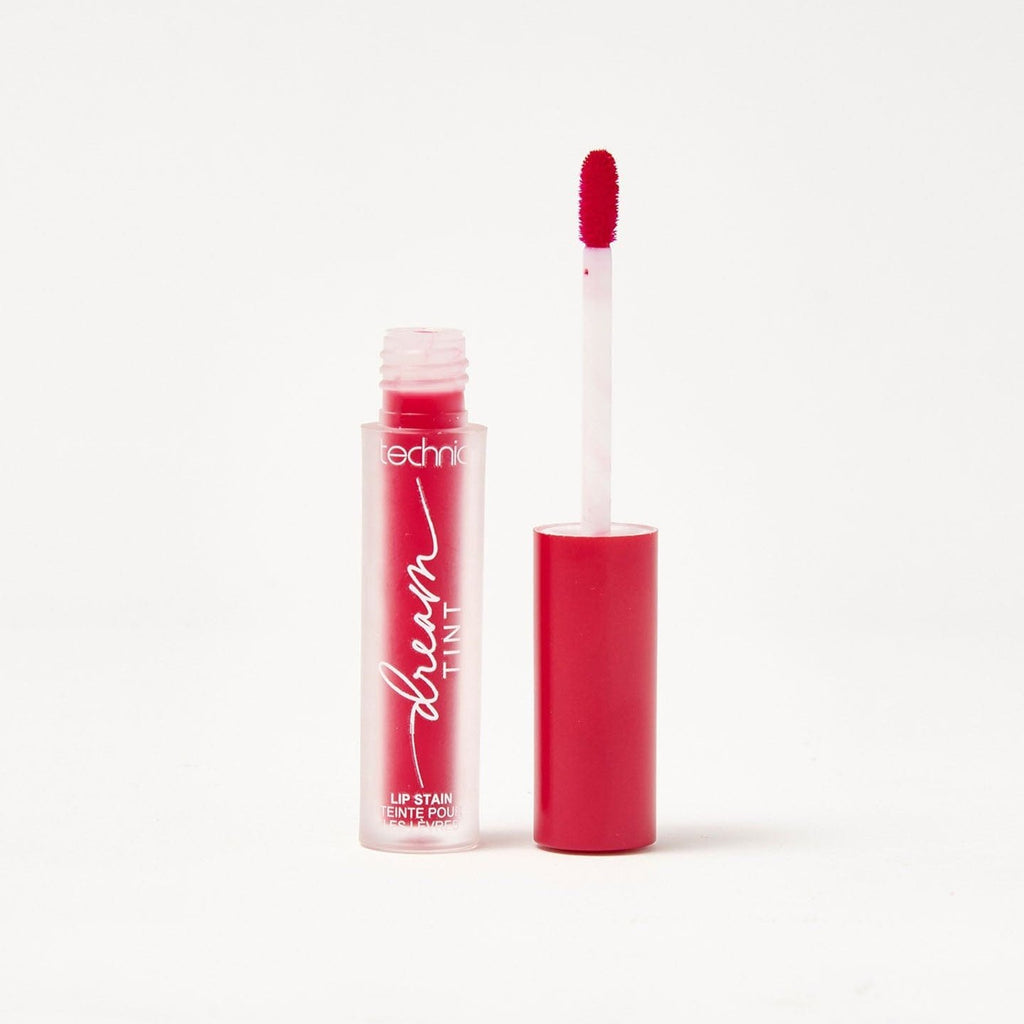 An opened dream lip tint in the shade Berry Haze on a white background.