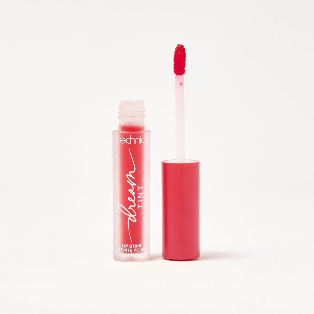 An opened dream lip tint in the shade Raspberry Mist on a white background.