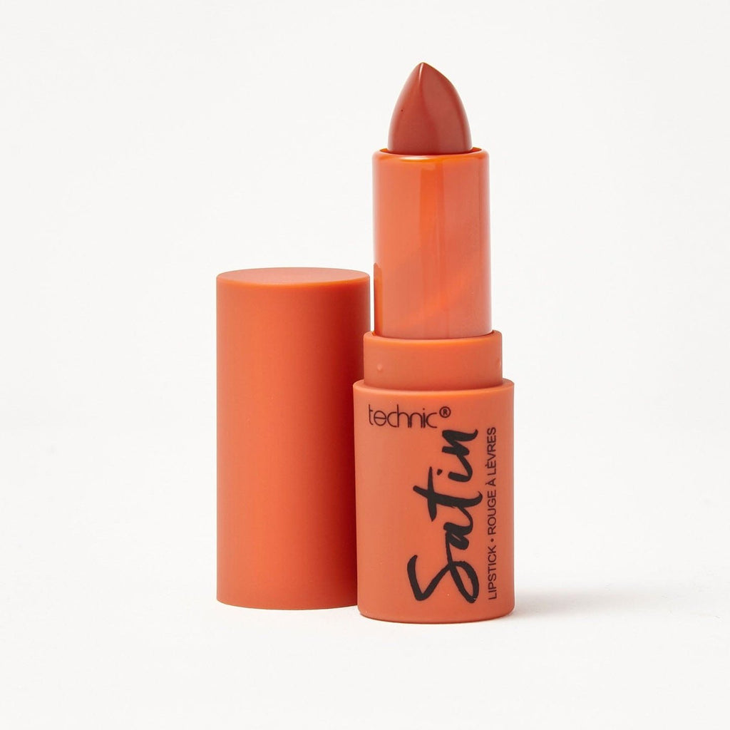 An opened satin lipstick in the shade True Velvet on a white background.