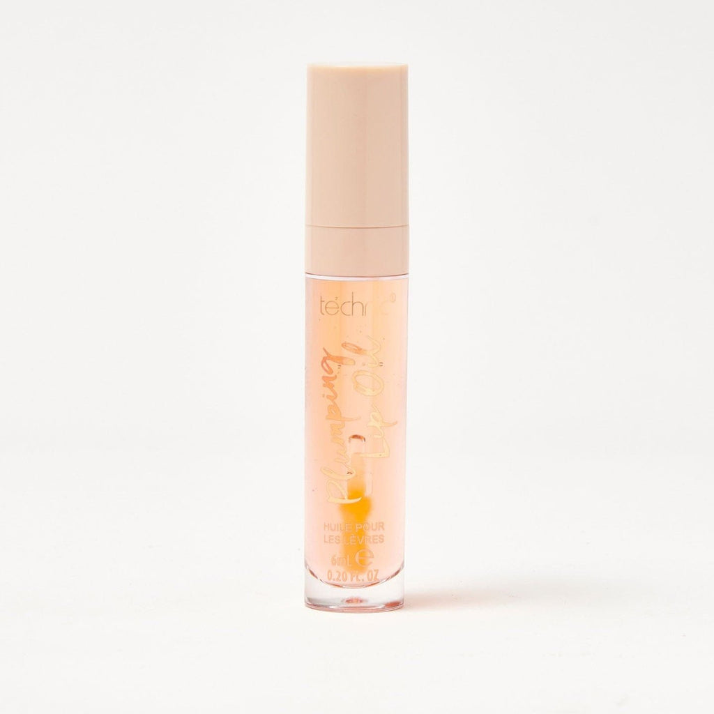 A plumping lip oil in the shade Everythings Peachy on a white background.