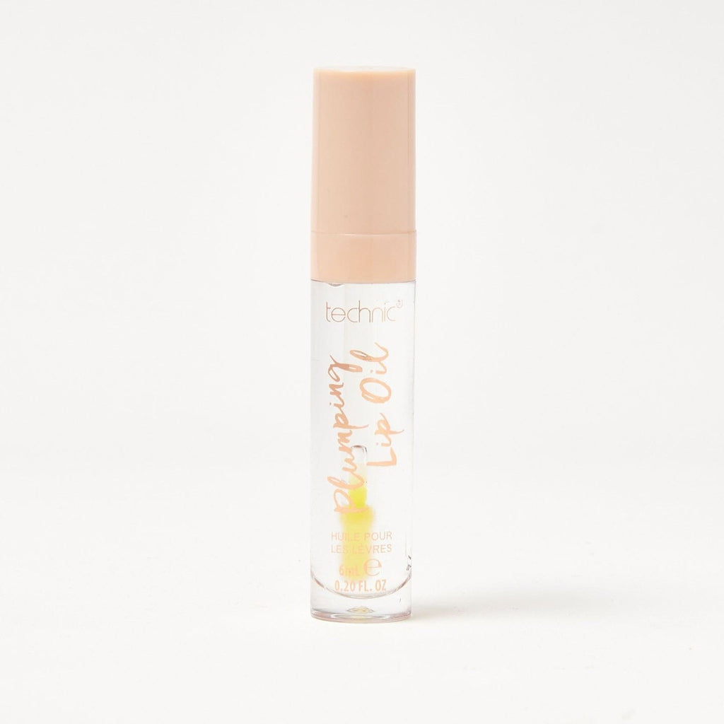 A plumping lip oil in the shade Sweet Thing on a white background.
