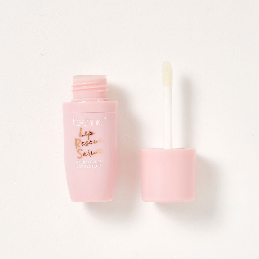 An opened lip rescue serum in a pink tube on a white background.