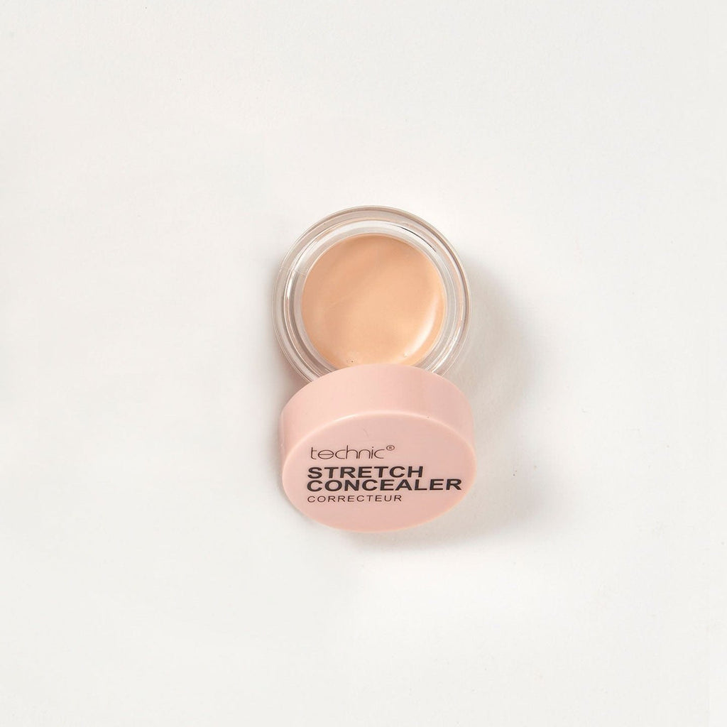 An opened stretch concealer in the shade Beige on a white background.