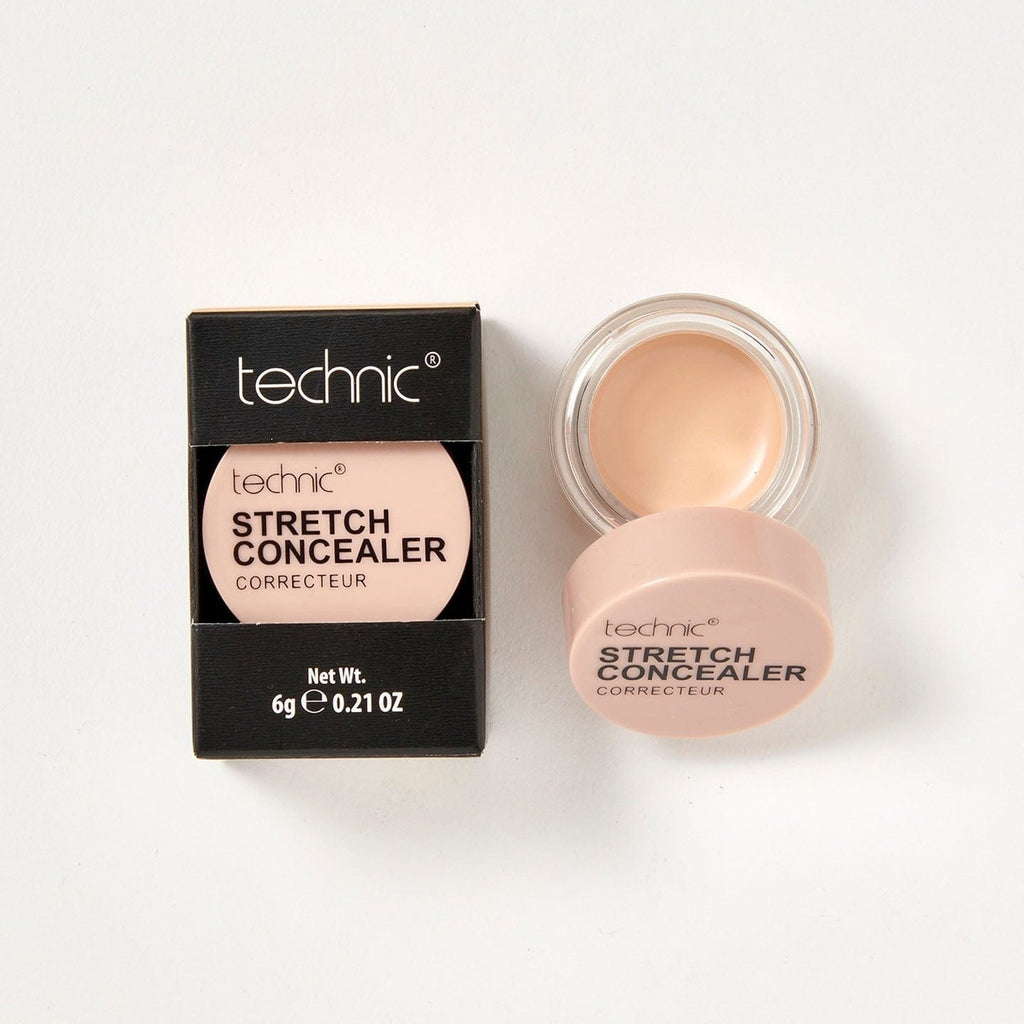 2 stretch concealers in the shade Buff next to each other on a white background. 1 is in it black coloured box packaging and the other is opened