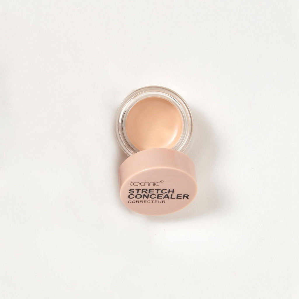 An opened stretch concealer in the shade Buff on a white background.