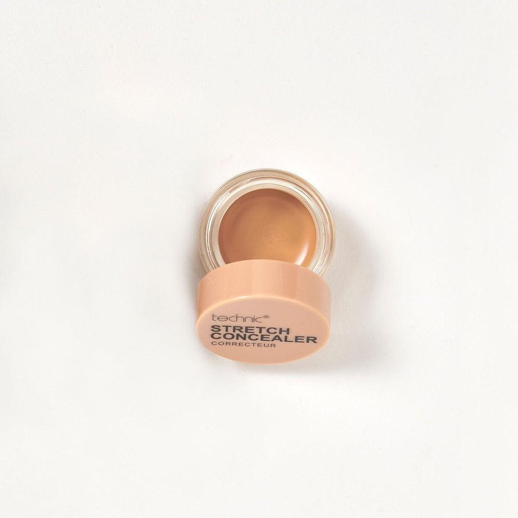 An opened stretch concealer in the shade Clay on a white background.