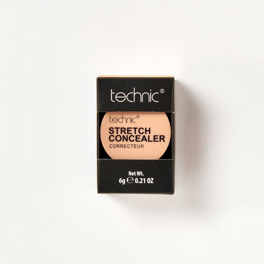 A stretch concealer in the shade Clay in its black coloured packaging on a white background.