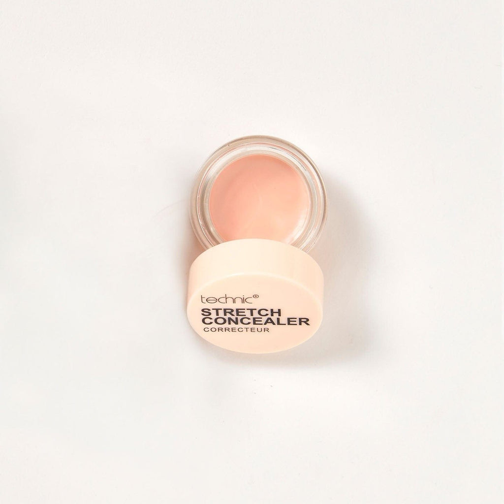 An opened stretch concealer in the shade Fair on a white background.