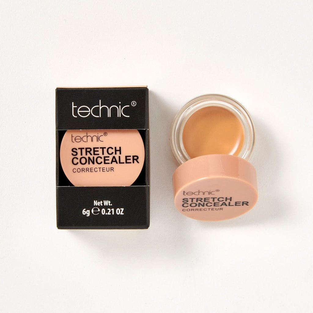 2 stretch concealers in the shade Warm Tan next to each other on a white background. 1 is in it black coloured box packaging and the other is opened