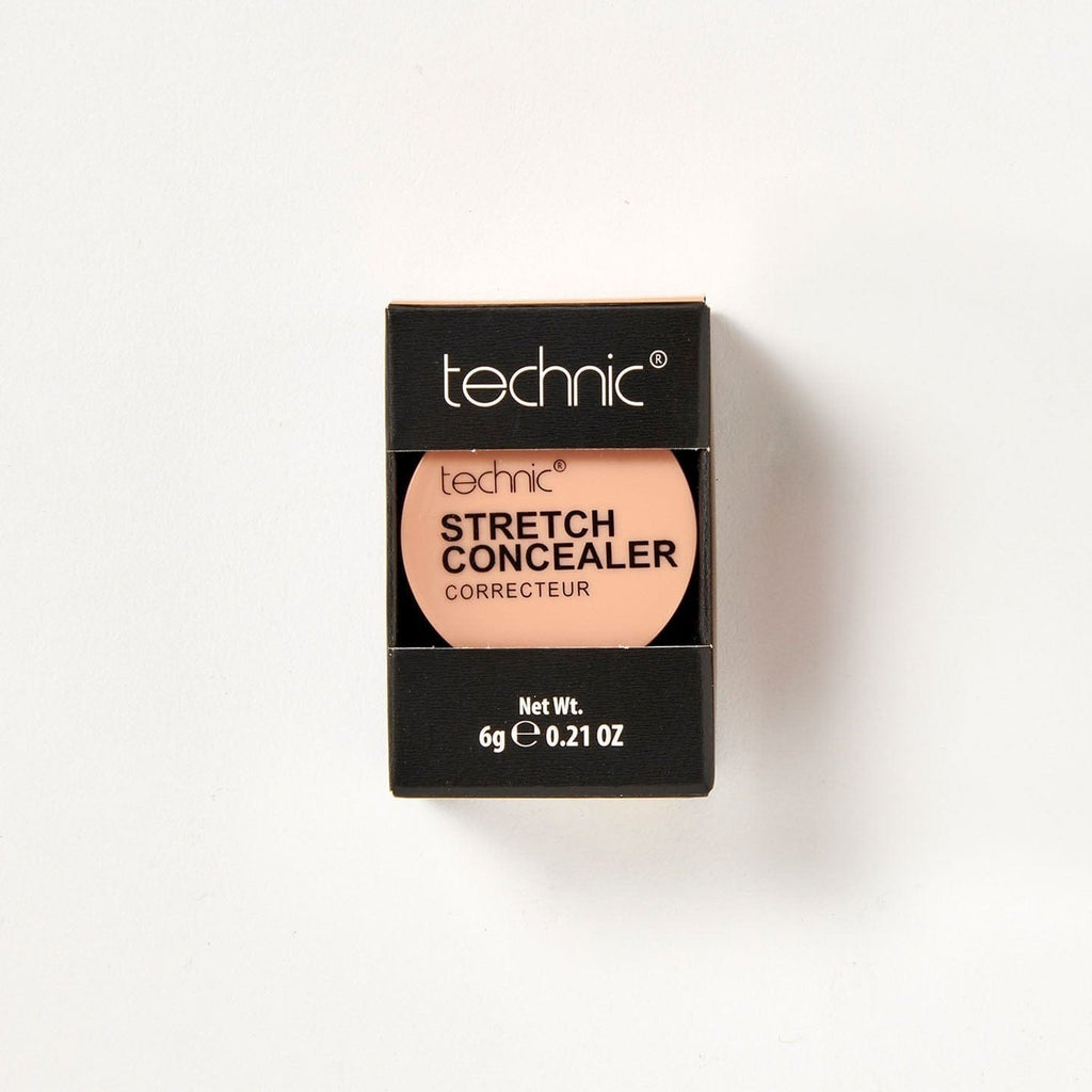 A stretch concealer in the shade Warm Tan in its black coloured packaging on a white background.