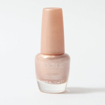 A bottle of shimmer nail varnish in the shade Seashell on a white background
