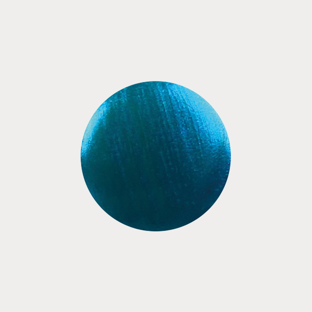 A swatch of the shade Lagoon. It is a shimmery bright blue colour.