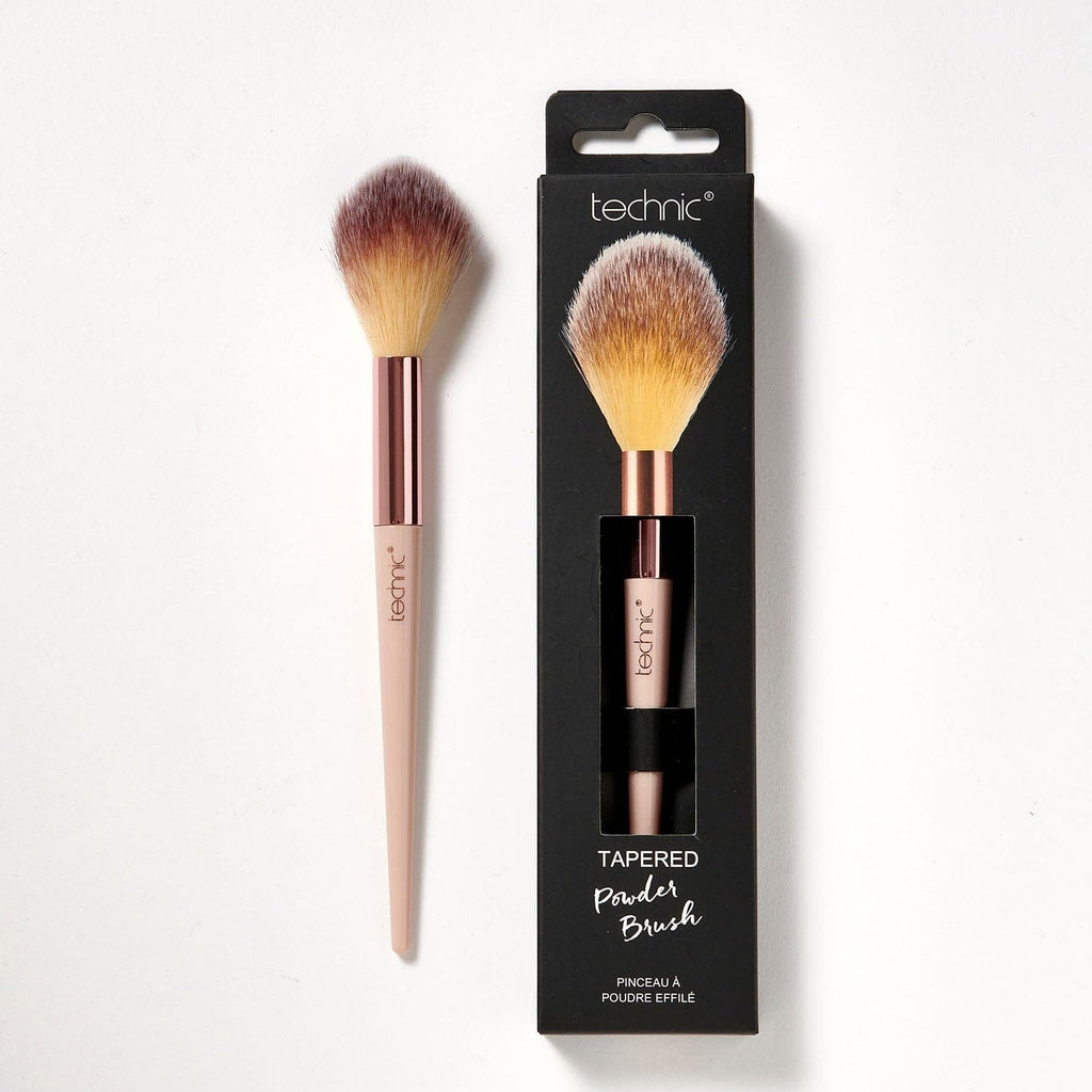 2 tapered powder brushes on a white background, 1 is in its box packaging and the other isnt.