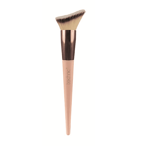 Liquid foundation brush out of box packaging on a white background.