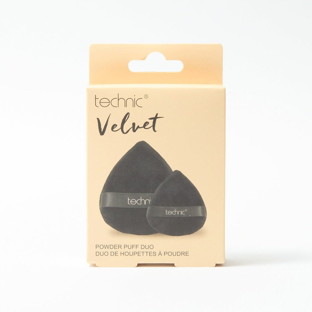 The velvet powder puff duo in packaging in front of a white background.