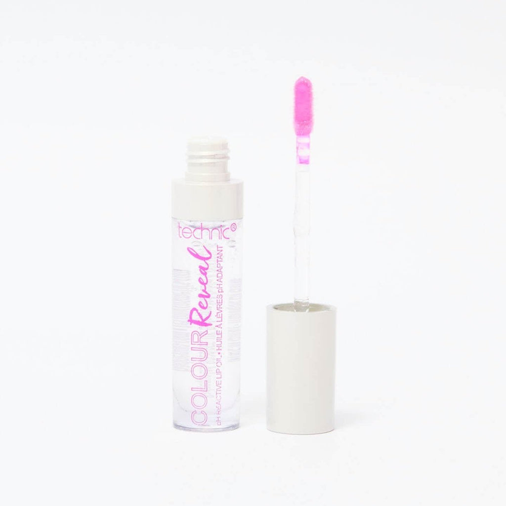 An opened colour reveal lip oil in the shade Too Hot in front of a white background.