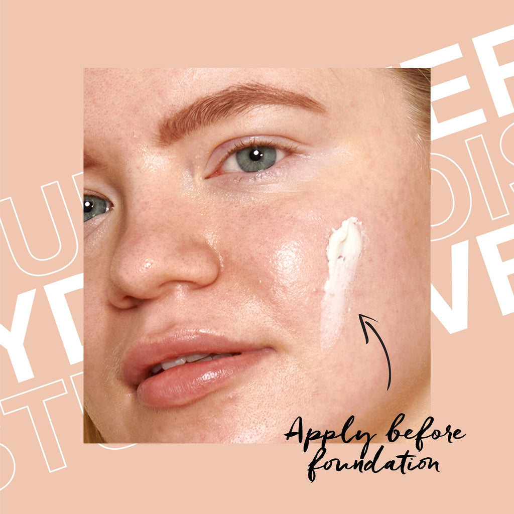 A close up of model with multi base applied to cheek.
