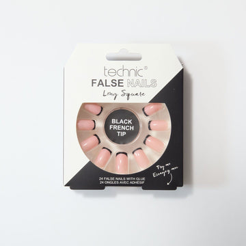 Black french tip long square nails in a black and white box on a white background.