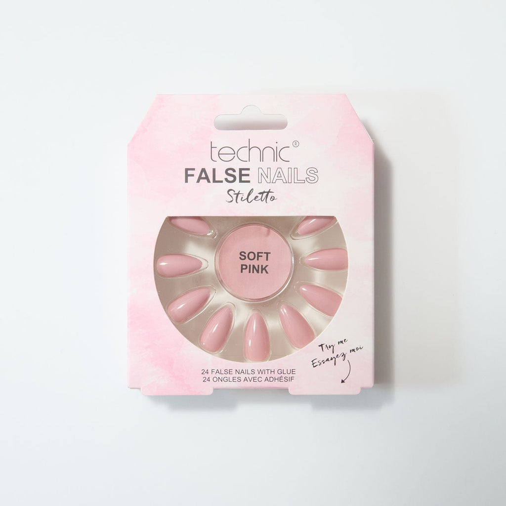 Soft pink stiletto nails in a baby pink box on a white background.
