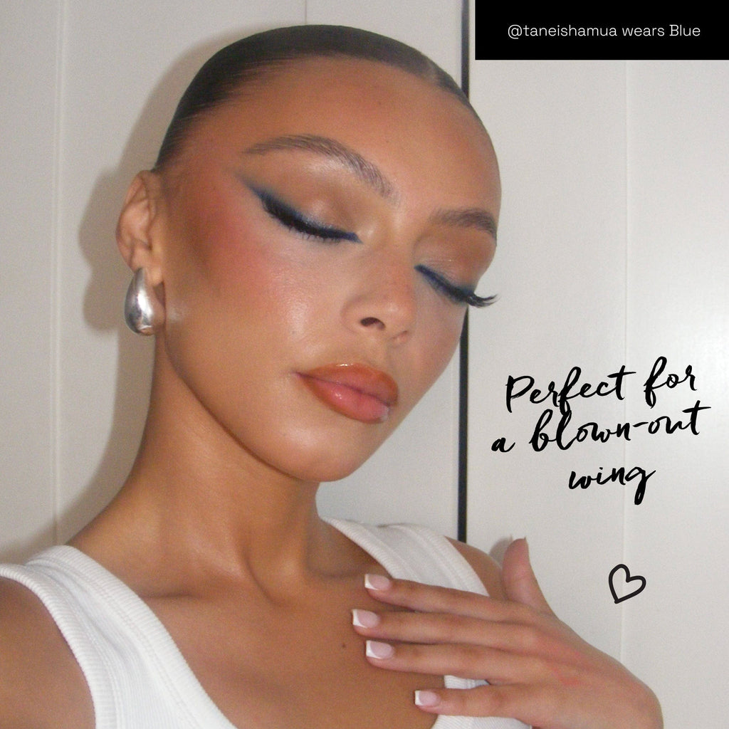 Model wearing the eyeliner in the colour Blue as a winged liner.