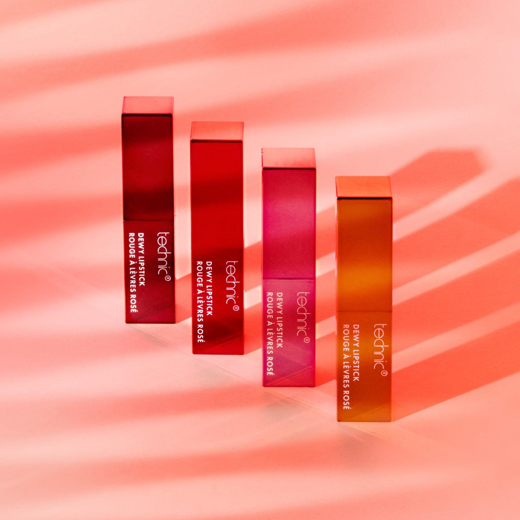 All 4 shades of dewy lipstick in a diagonal row with a sunset coloured background.