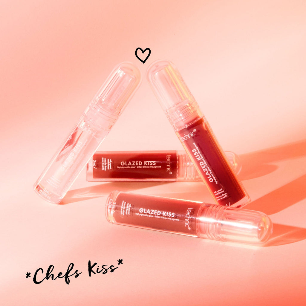 4 shades of the glazed kiss lip glosses displayed in different positions with a sunset coloured background.