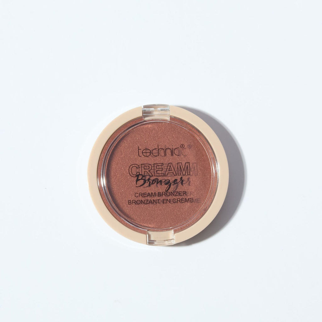 A cream bronzer in the shade Dark on a white background.