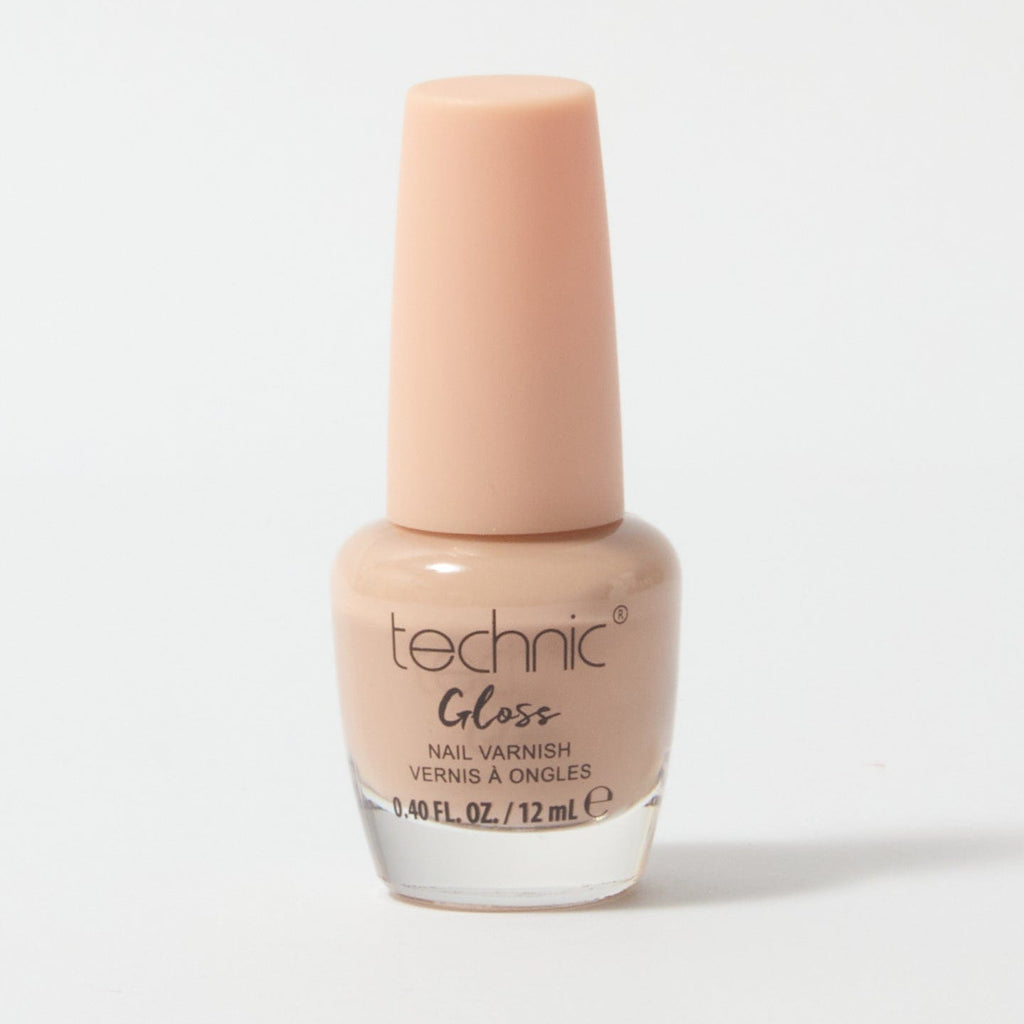 A bottle of gloss nail varnish in the shade Champers on a white background. It is a peach gloss colour.