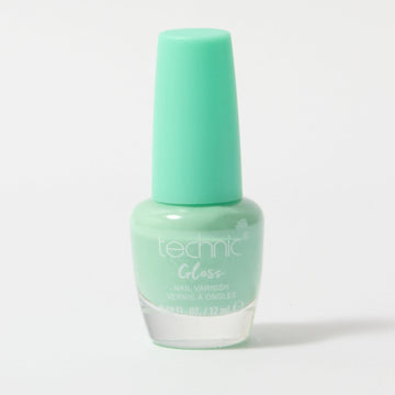 A bottle of gloss nail varnish in the shade Vibes on a white background. It is a bright turquoise colour
