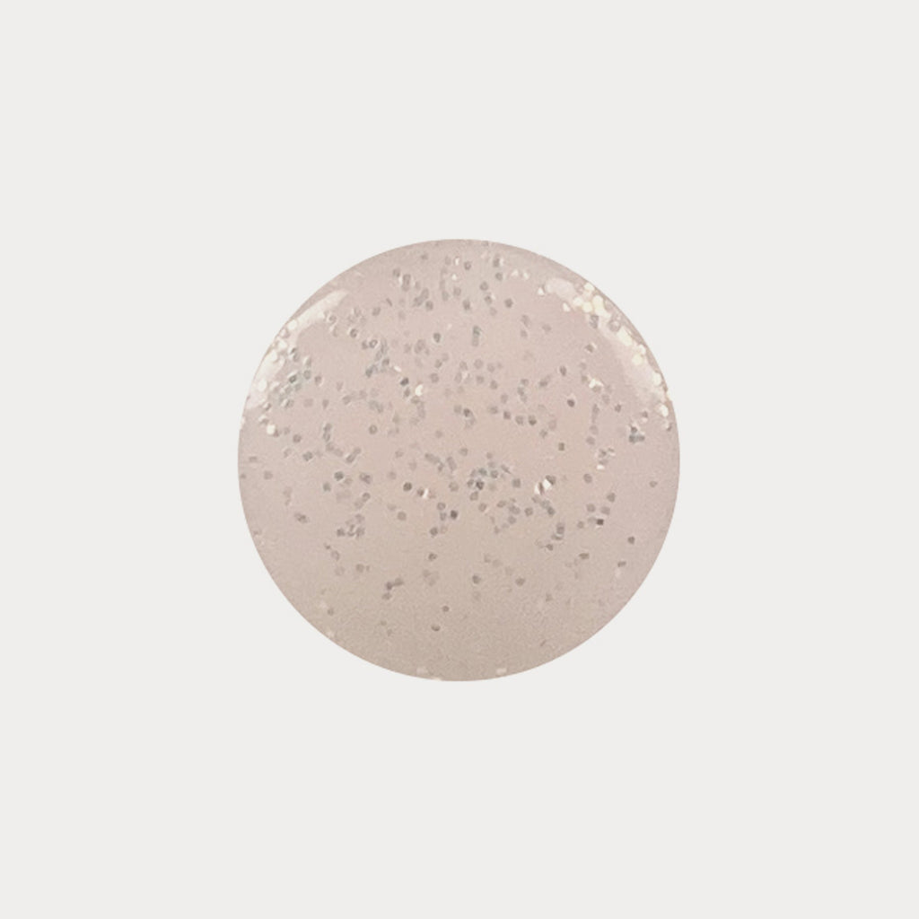 A swatch of the shade Festival Fever. Its a peach colour with sequin speckles in it.