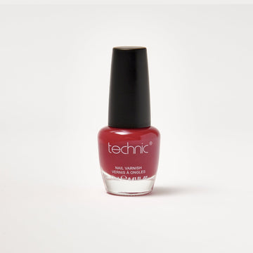 A nail varnish bottle in the shade Tango Red in front of a white background.