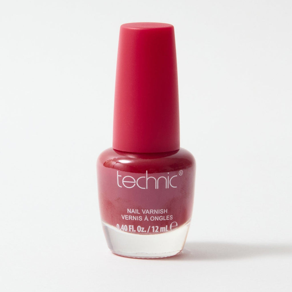 A bottle of nail varnish in the shade Tango Red on a white background