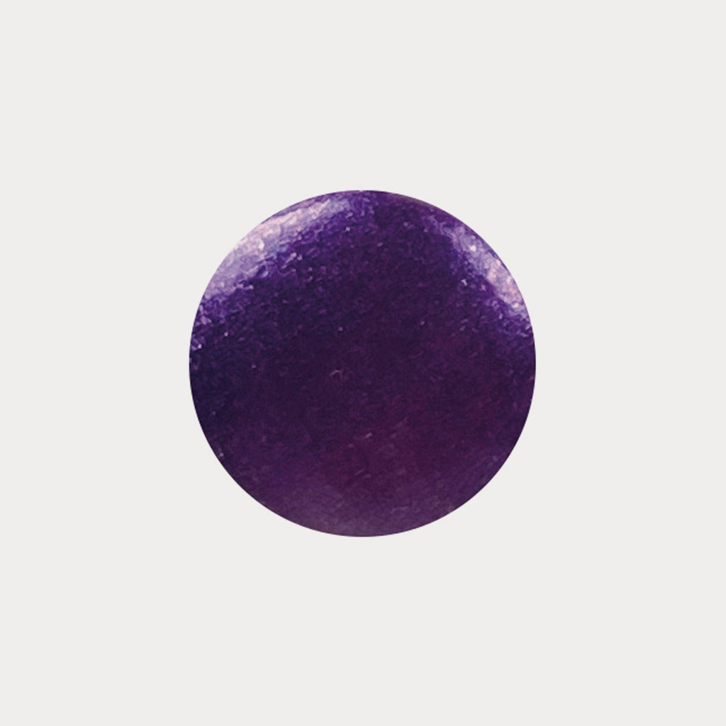 A swatch of the shade Purple Rain. It is a shimmery dark purple.