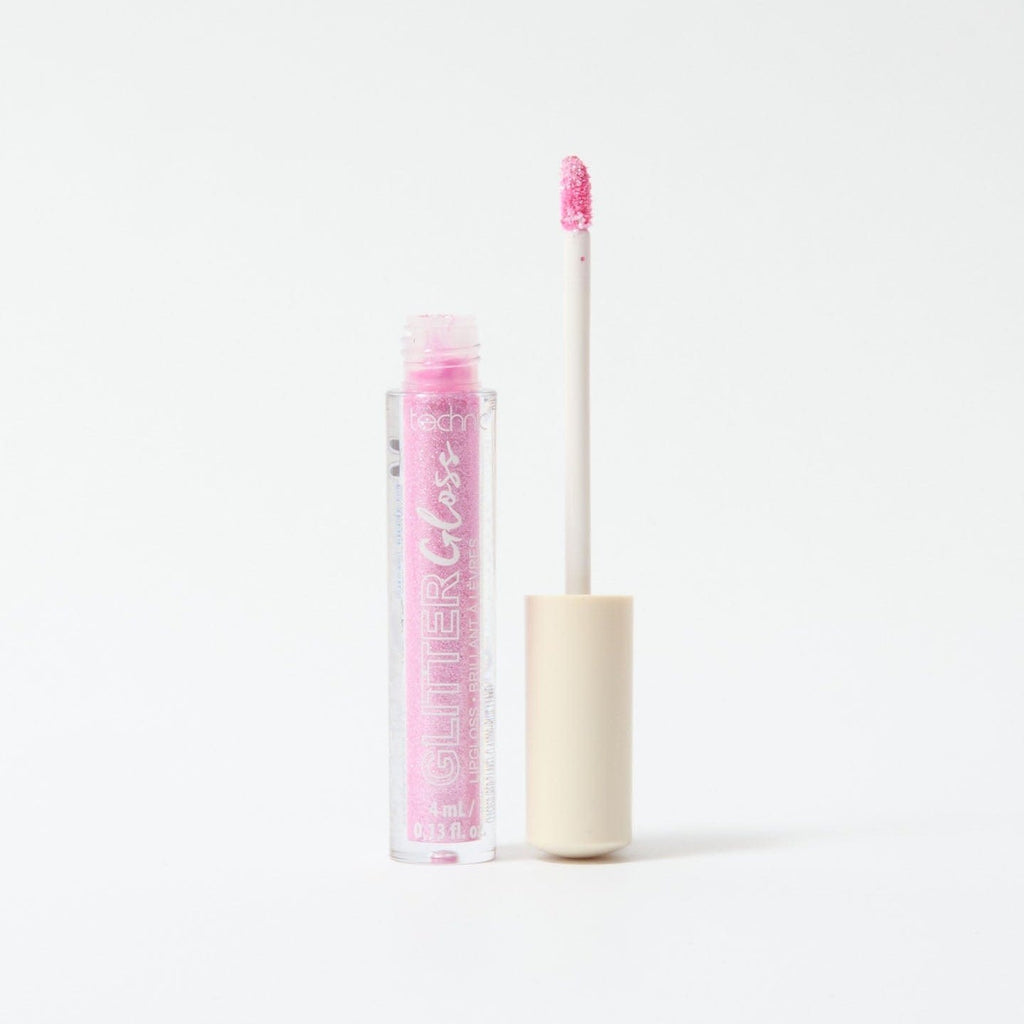 An opened glitter gloss in the shade Bright Pink on a white background.