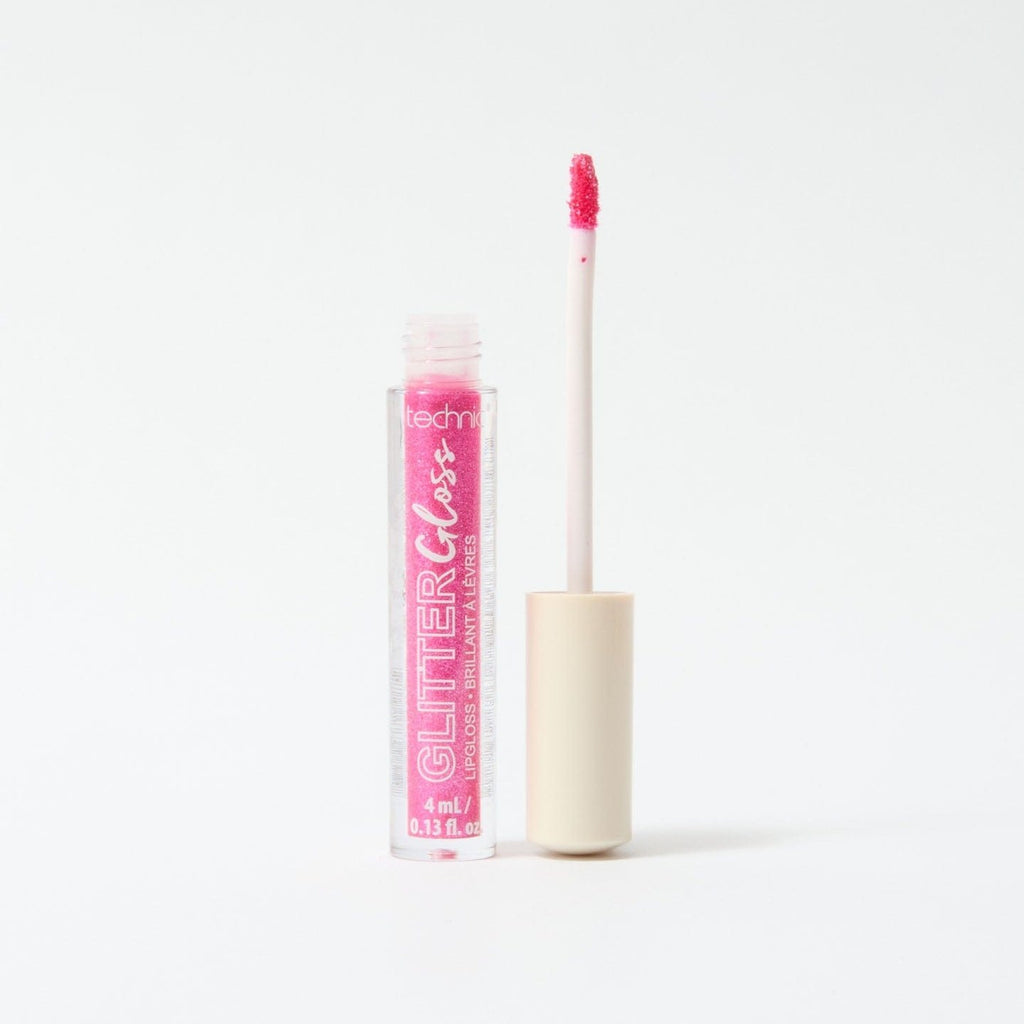 An opened glitter gloss in the shade Fuchsia on a white background.