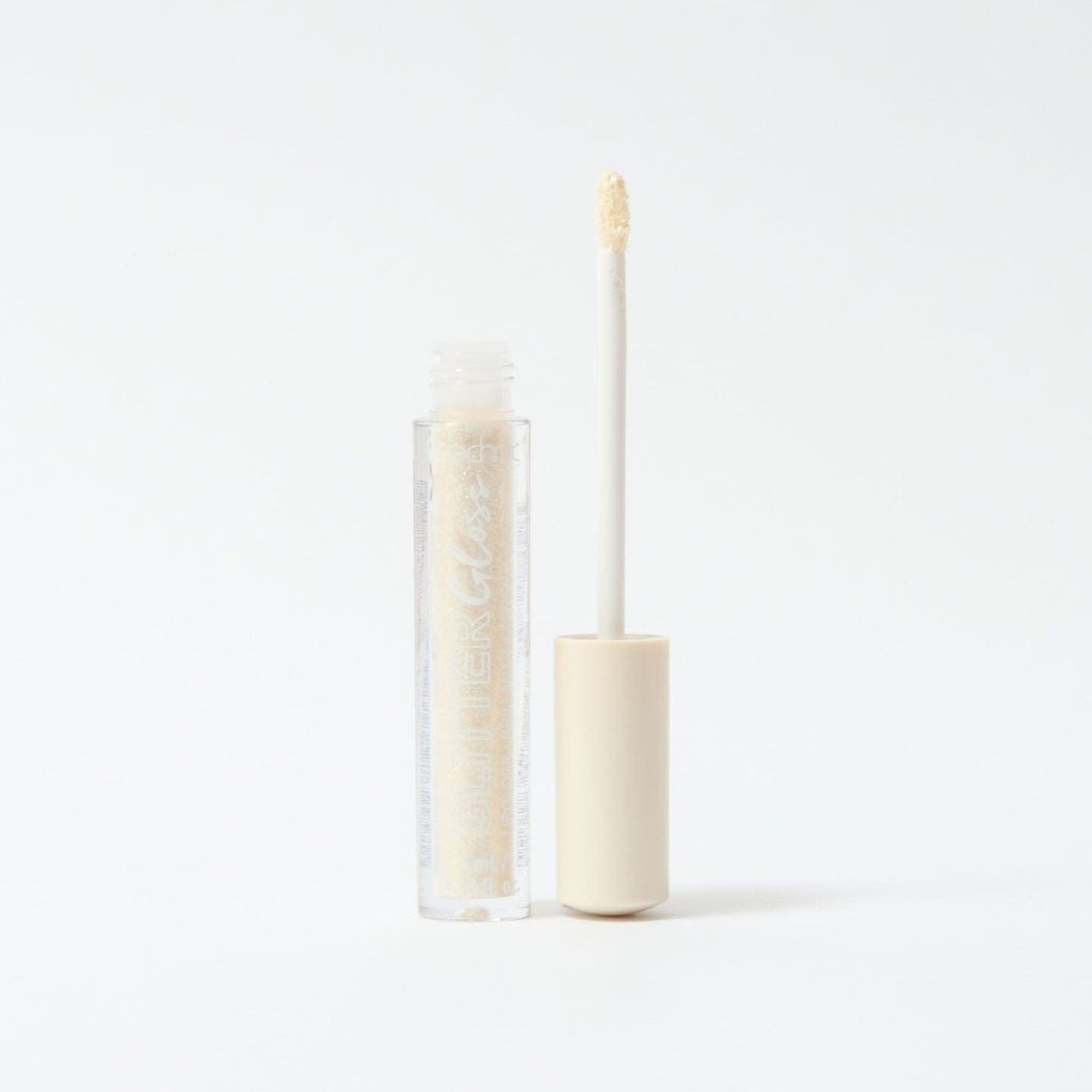 An open glitter gloss in he shade Gold on a white background.