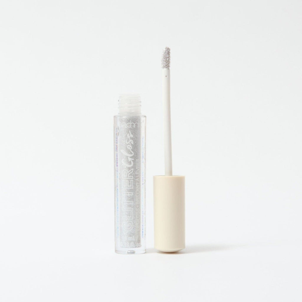 An opened glitter gloss in the shade Silver on a white background.