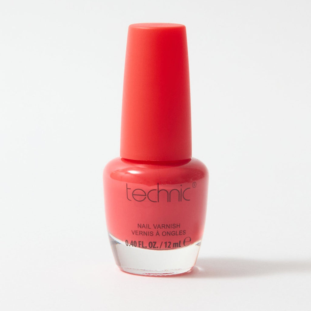 A bottle of nail varnish in the shade Coral on a white background