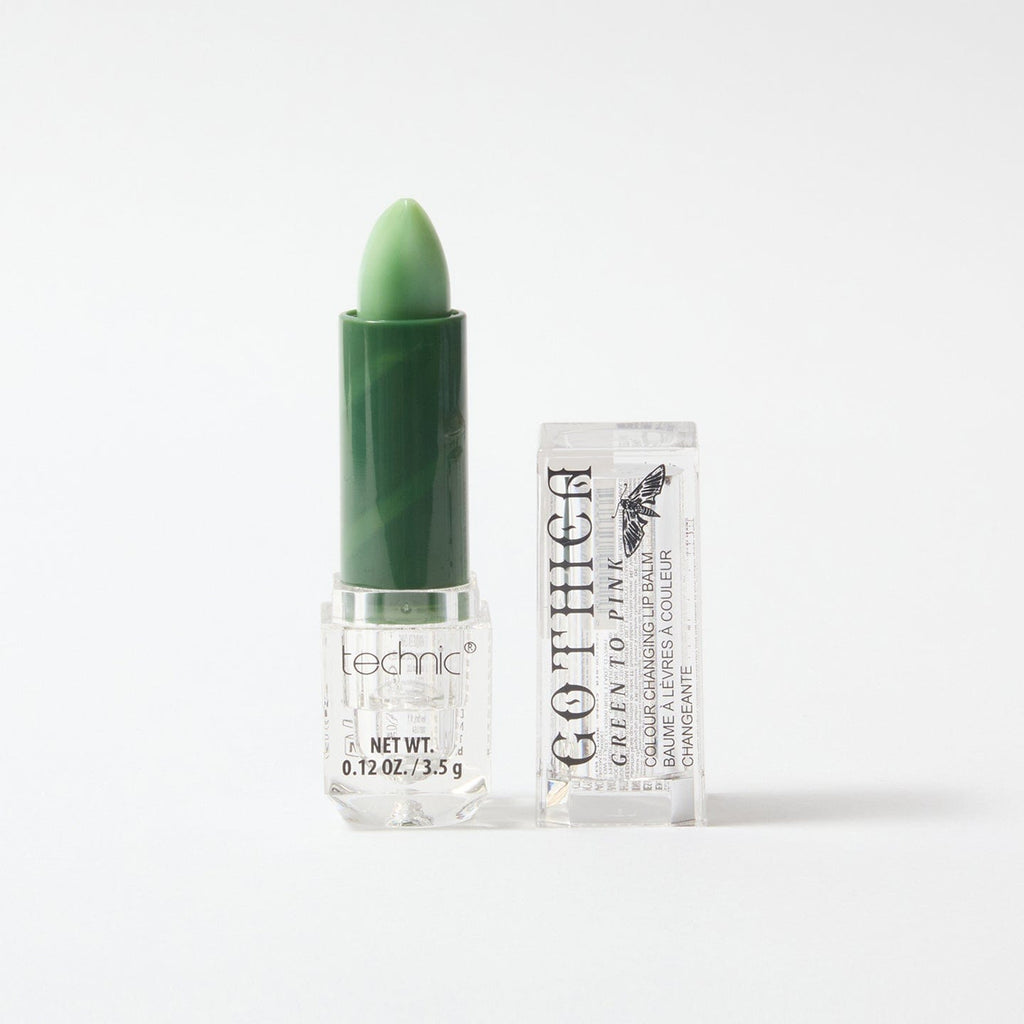 Gothica opened colouring changing lip balm in the colour green, on a white background.